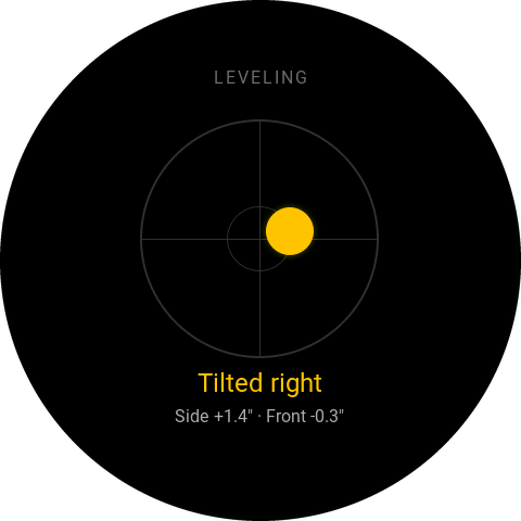 Leveling screen with the bubble off to the right, reading Tilted right, side plus 1.4 inches and front minus 0.3 inches